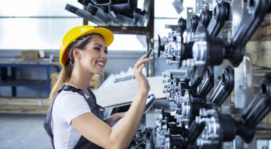 woman-industrial-employee-working-uniform-hardhat-checking-production-factory